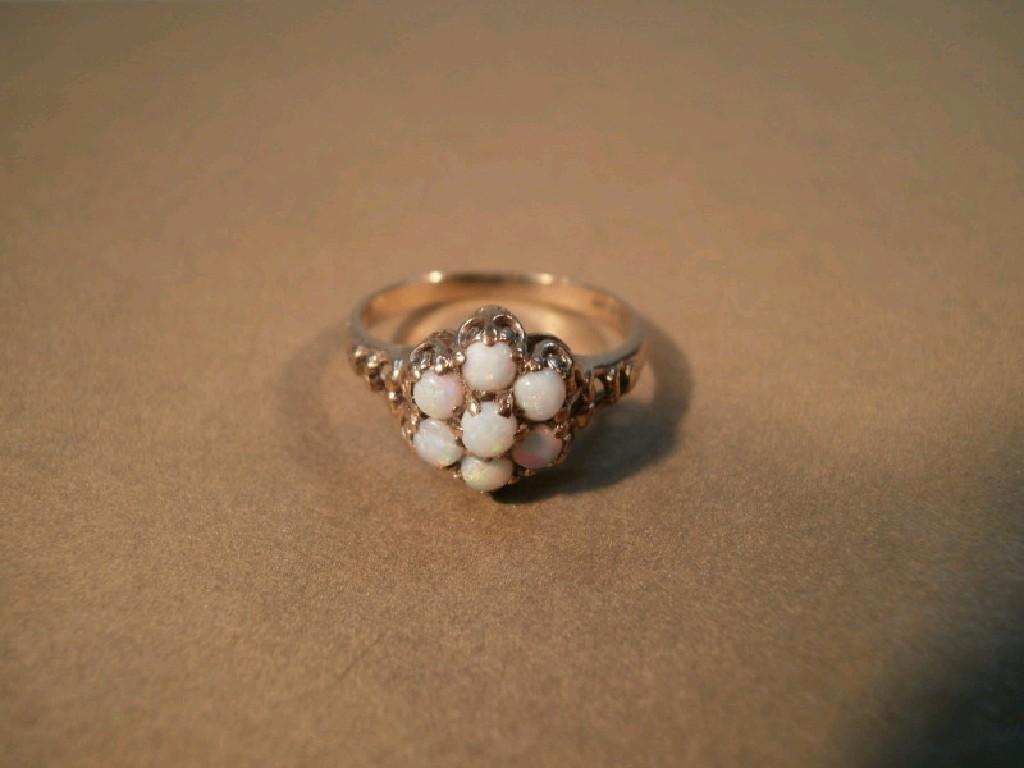 Appraisal: An opal cluster ct gold dress ring