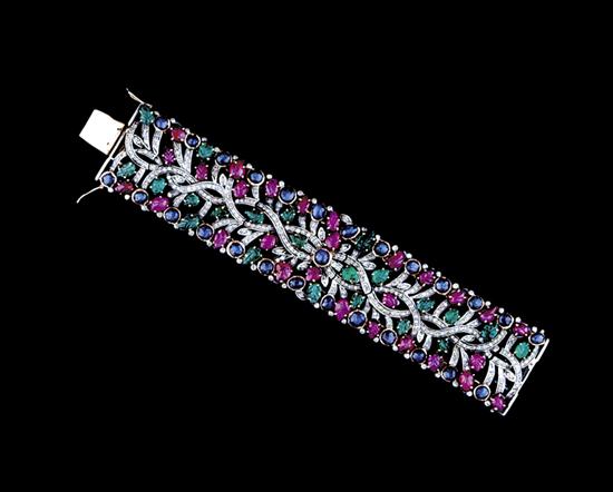 Appraisal: Diamond ruby sapphire and emerald bracelet openwork floral design set