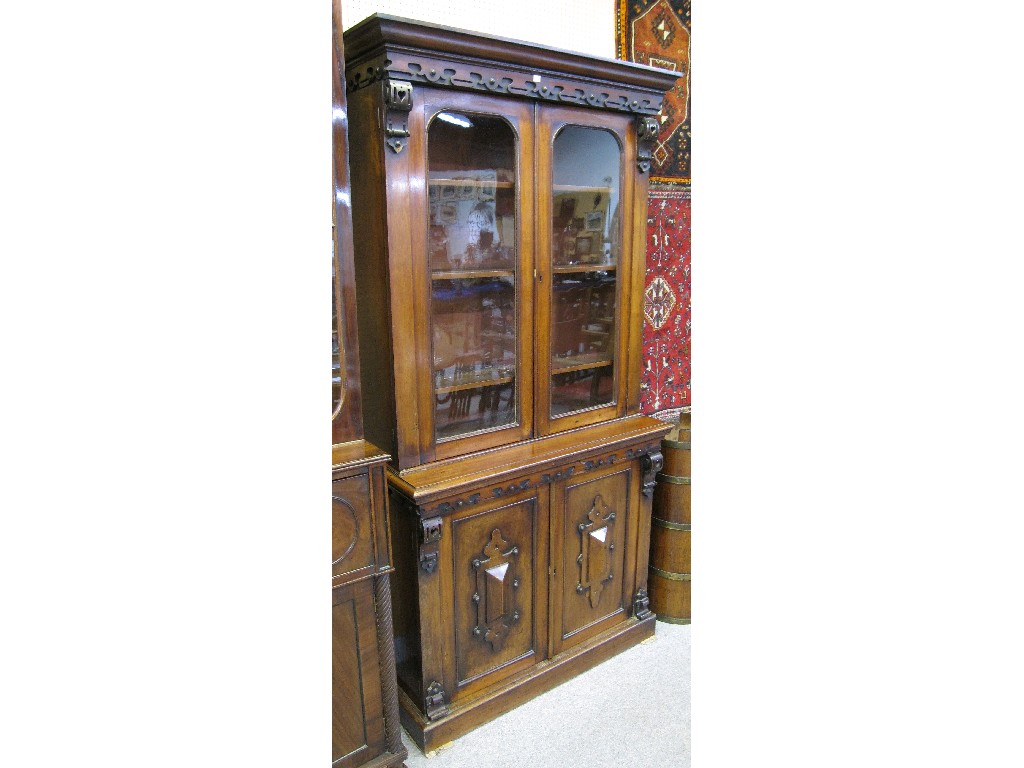 Appraisal: Mahogany library bookcase the glazed top with blind fret decorated