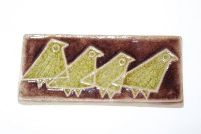 Appraisal: A Soholm pottery plaque with four stylised birds in green