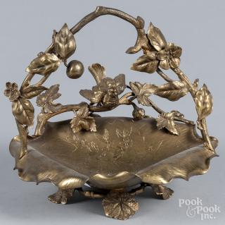 Appraisal: Gilt metal basket with engraved floral decoration and applied bird