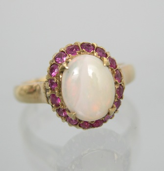 Appraisal: A Delicate White Opal and Ruby Ring k yellow gold