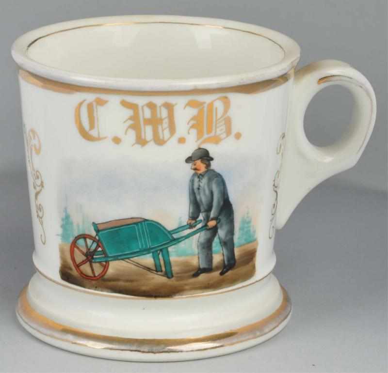 Appraisal: Man with Wheelbarrow Shaving Mug Description Gilt initials C W