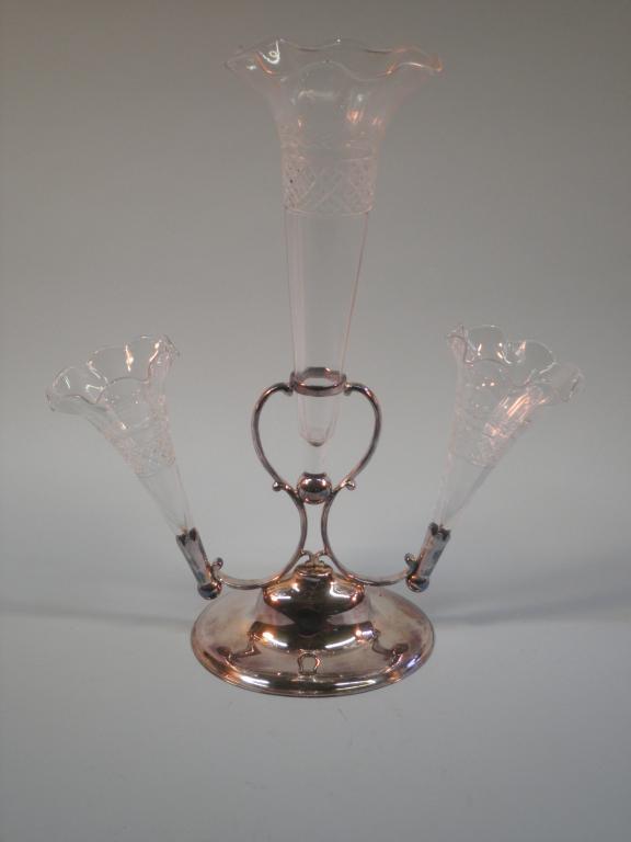 Appraisal: An Edwardian silver plated epergne with three cut glass trumpet