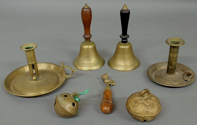 Appraisal: Group of brassware- chambersticks hand bells tallest h sleigh bells