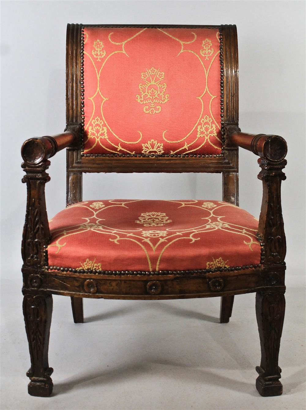 Appraisal: CONTINENTAL CARVED WALNUT ARMCHAIR WITH ROSE UPHOLSTERY having a reeded