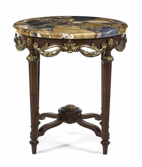 Appraisal: A Louis XVI Style Parcel Gilt Mahogany Occasional Table having