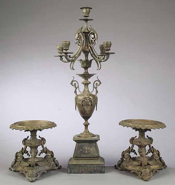 Appraisal: A French Neo-Grec Bronze Five-Light Candelabrum c the masque-decorated urn