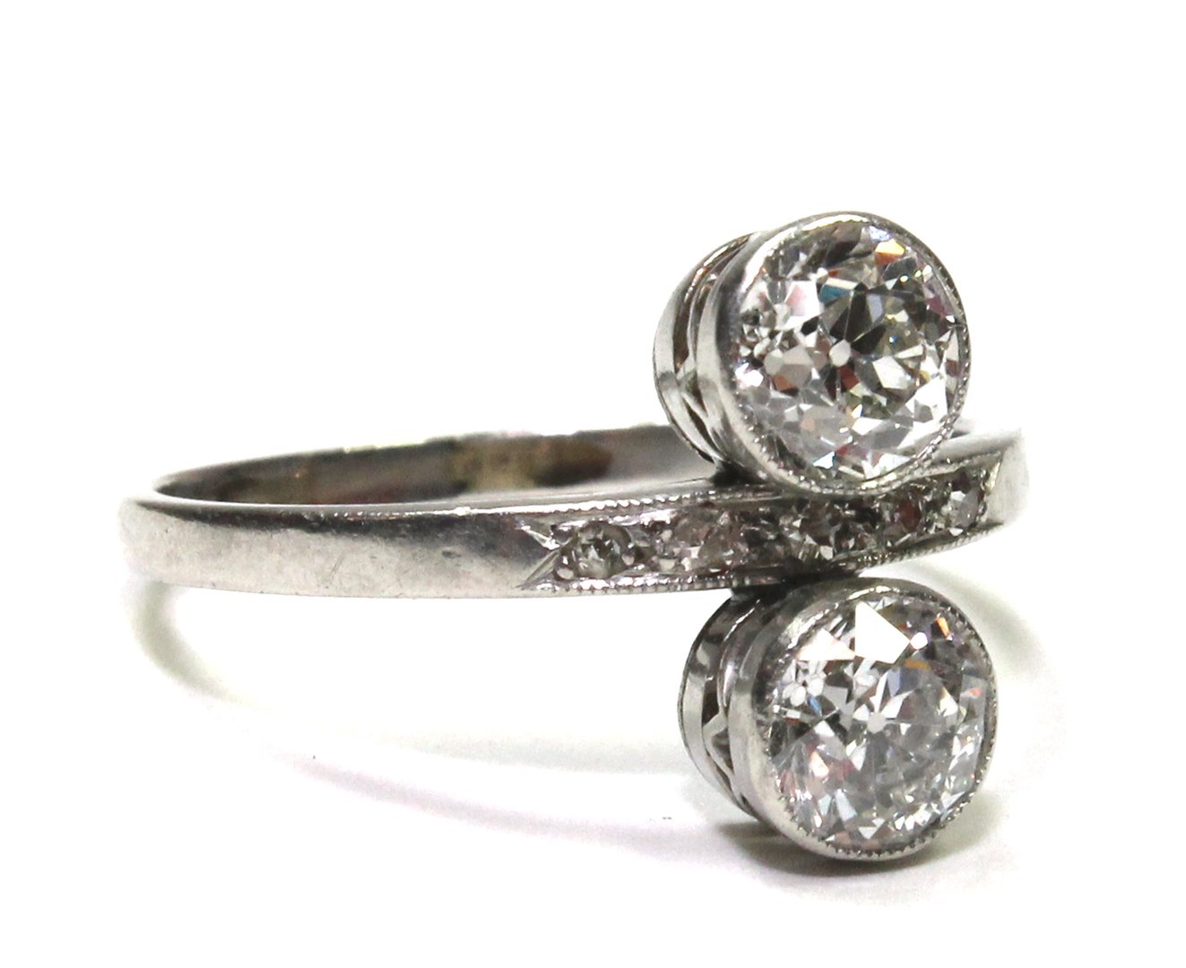 Appraisal: A diamond ring collet set with the two principal cushion