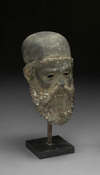 Appraisal: A patinated bronze head of a Classical male after the