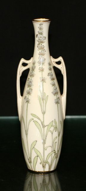 Appraisal: A Royal Doulton twin handled vase delicately painted with stylised