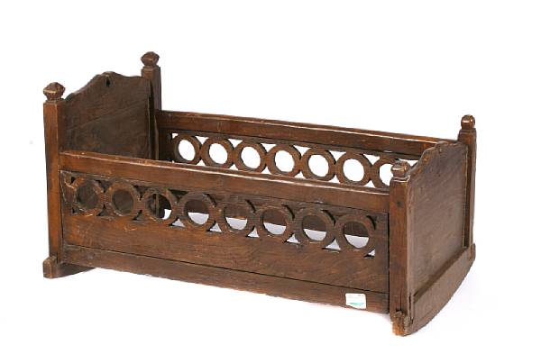 Appraisal: A Continental oak crib together with a sled height of