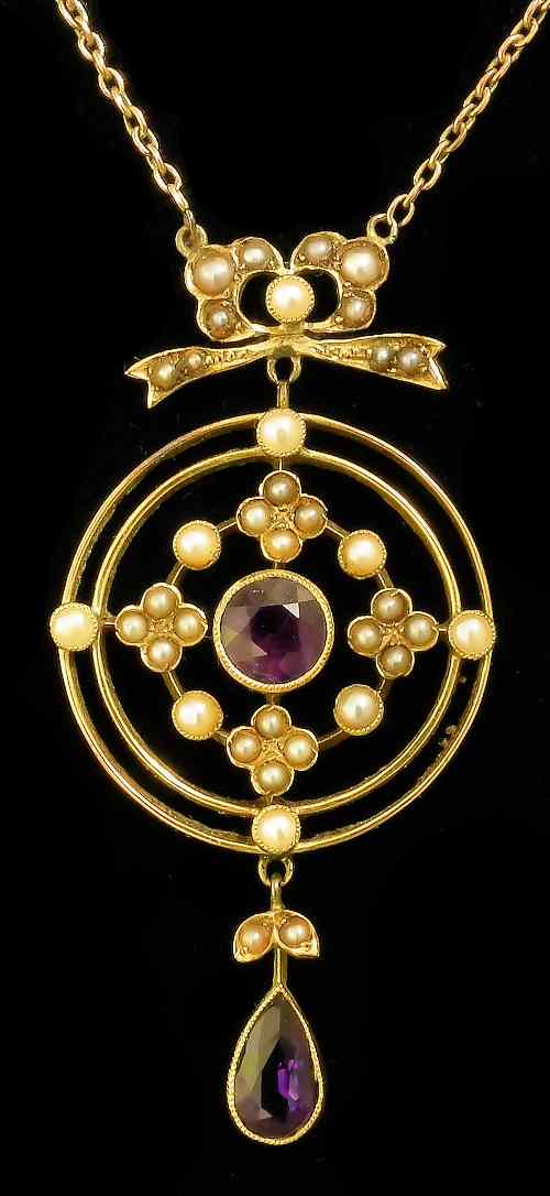 Appraisal: A late Victorian amethyst and seed pearl mounted pendant the