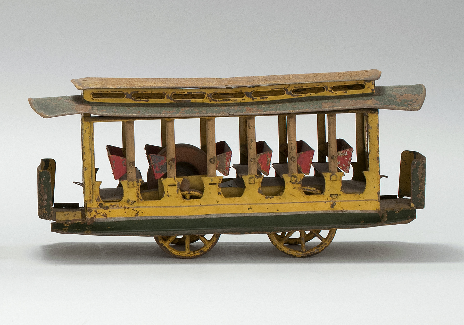 Appraisal: PRESSED TIN SUMMER TROLLEY HILL CLIMBER TOY Circa Possibly by