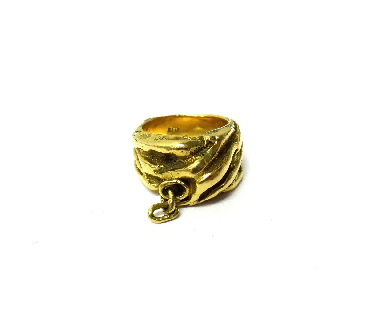 Appraisal: A gold ring cast in an abstract design with a