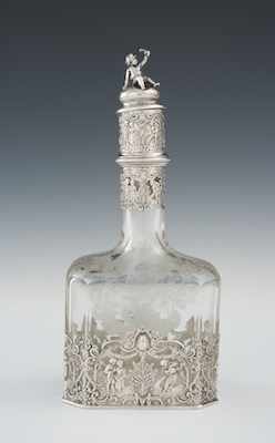 Appraisal: A German Silver Mounted Etched Crystal Wine Decanter by Storck