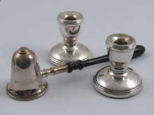 Appraisal: A pair of hallmarked silver miniature candlesticks cm high together