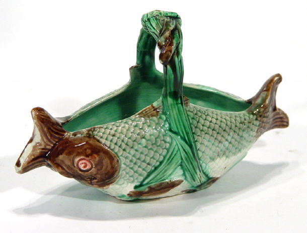 Appraisal: Majolica pottery basket modelled as two fish with reed handle