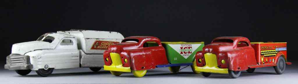 Appraisal: Antique Wyandotte TrucksTo include a Toytown Ice company truck a