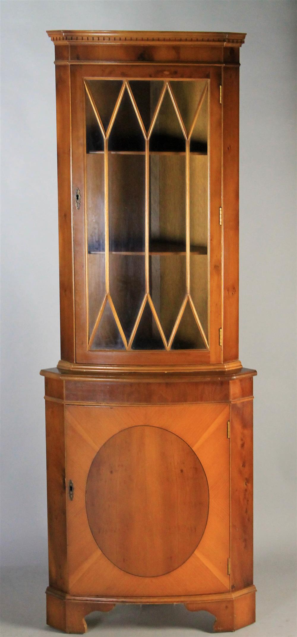 Appraisal: GEORGIAN STYLE YEW WOOD CORNER CUPBOARD having a step back