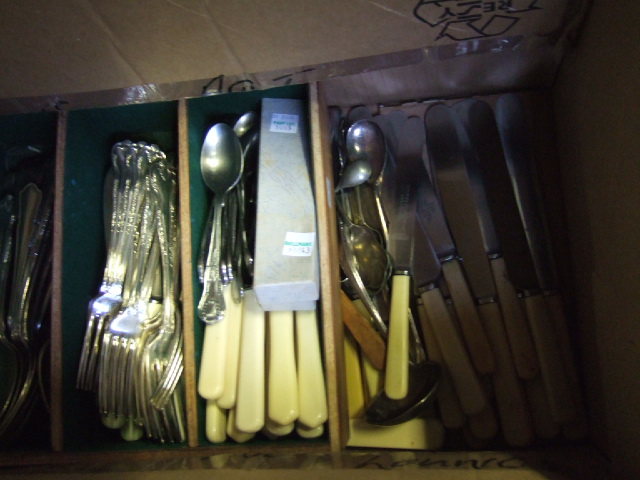 Appraisal: A quantity of mostly plated table flatware including knives forks