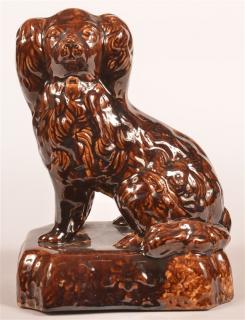 Appraisal: Rockingham Glazed Yellowware Seated Spaniel Rockingham Glazed Yellowware Seated Spaniel