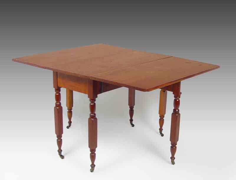 Appraisal: LONG CHERRY DROP LEAF SWING LEG TABLE Cherry wood with