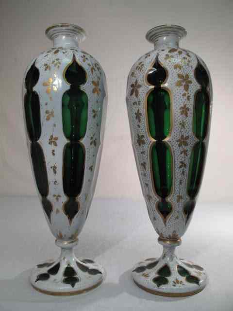 Appraisal: A pair of Bohemian green glass vases with white overlay