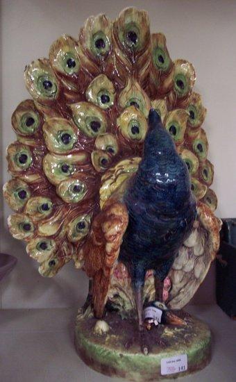 Appraisal: A Continental majolica peacock the underside impressed cm high