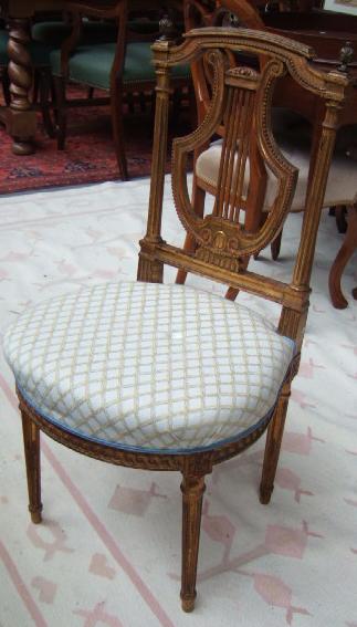 Appraisal: A set of four late th century giltwood salon chairs