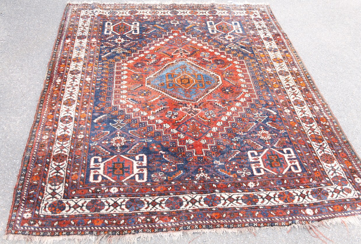 Appraisal: A Persian type rug with a central medallion on a