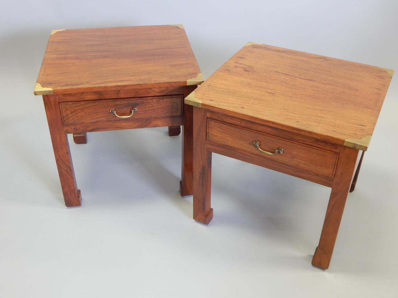 Appraisal: A pair of Eastern hardwood and brass inlaid low tables