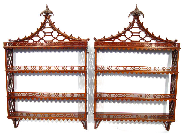 Appraisal: Pair of Chippendale design mahogany hanging bookcases in the Chinese