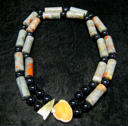 Appraisal: Onyx jasper and coral necklaceOnyx and jasper beads accented by