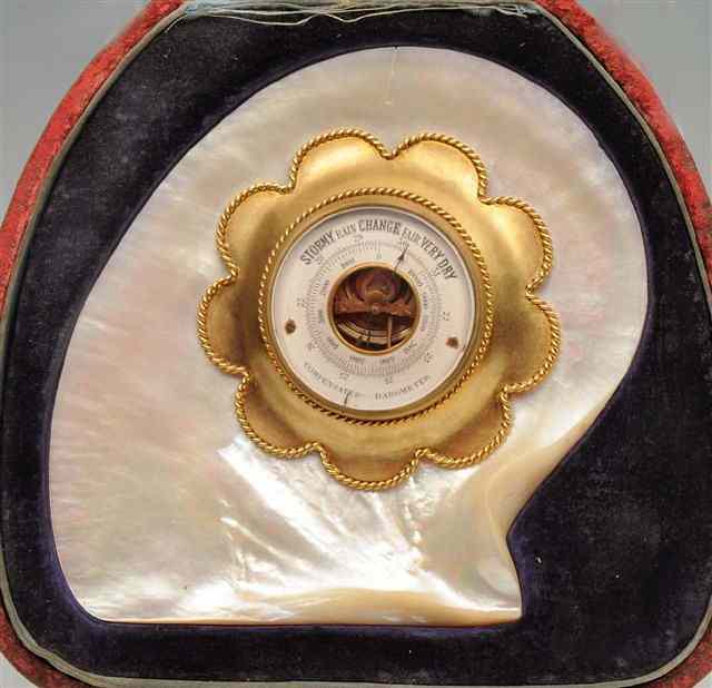 Appraisal: A LATE VICTORIAN COMPENSATED ANEROID BAROMETER in a gilt petal