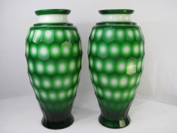 Appraisal: Pair of green overlay on white glass vases cut with