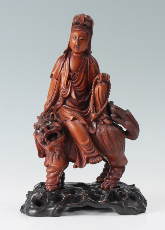 Appraisal: CHINESE CARVED FIGURE OF QUAN YIN ON A FOO LION