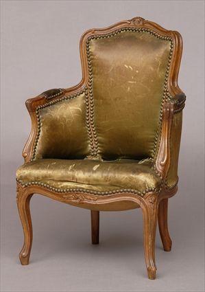 Appraisal: LOUIS XV-STYLE CARVED BEECHWOOD BERGERE EN CABRIOLET With flower-carved crest