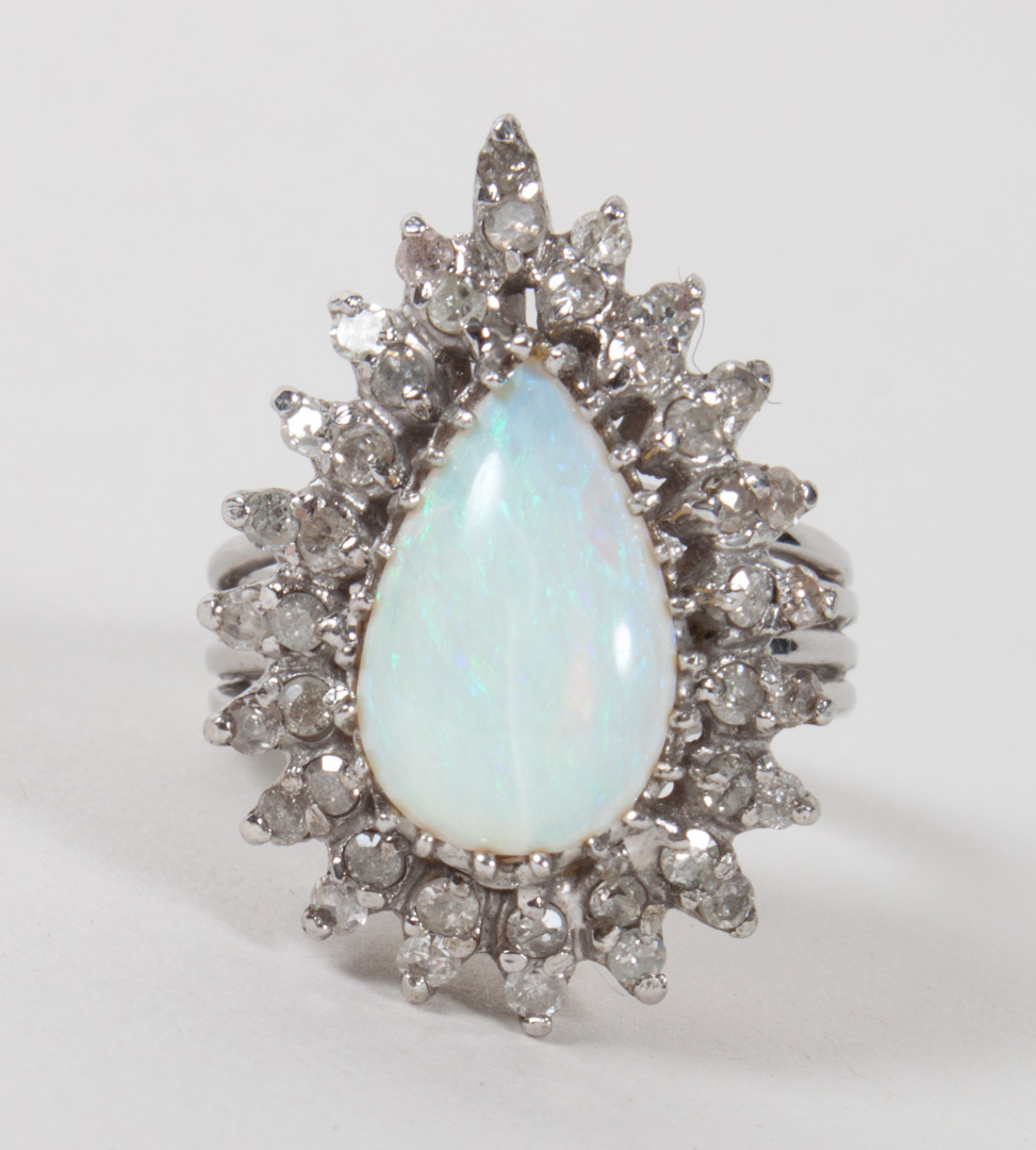 Appraisal: White gold diamond and opal cocktail ring K grams