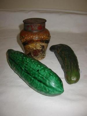 Appraisal: TWO POTTERY CUCUMBERS modelled realistically one with matt and the