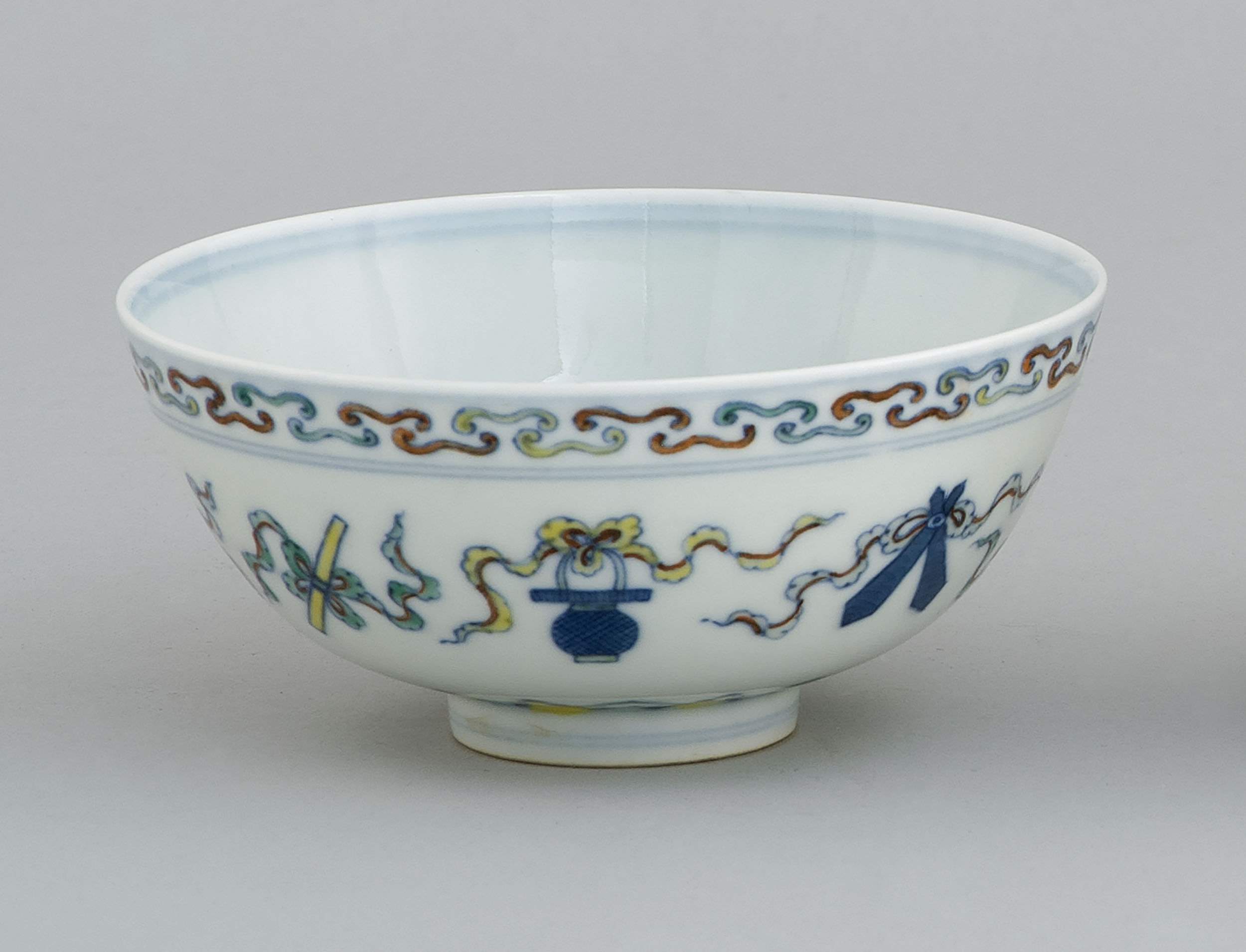 Appraisal: DOUCAI PORCELAIN BOWL With pahua design between lappet and scroll