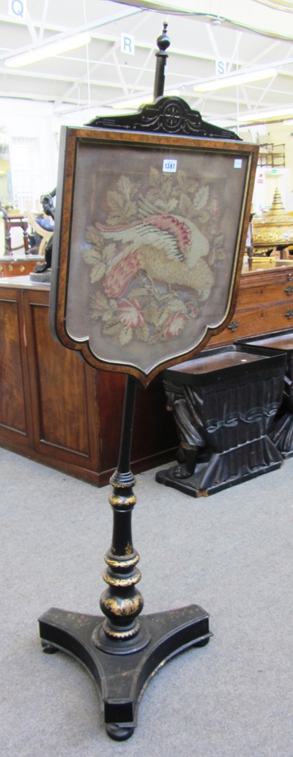 Appraisal: A th century parcel gilt papiermache pole screen on tripod