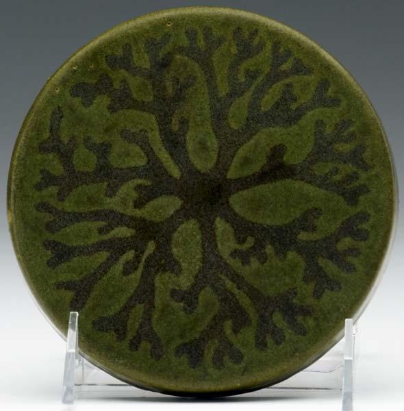 Appraisal: MARBLEHEAD Circular trivet tile decorated with a sea plant in