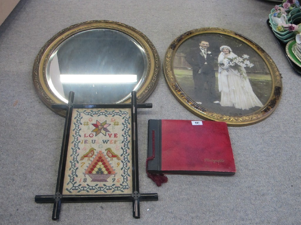 Appraisal: Photograph album sampler framed wedding photograph and a mirror