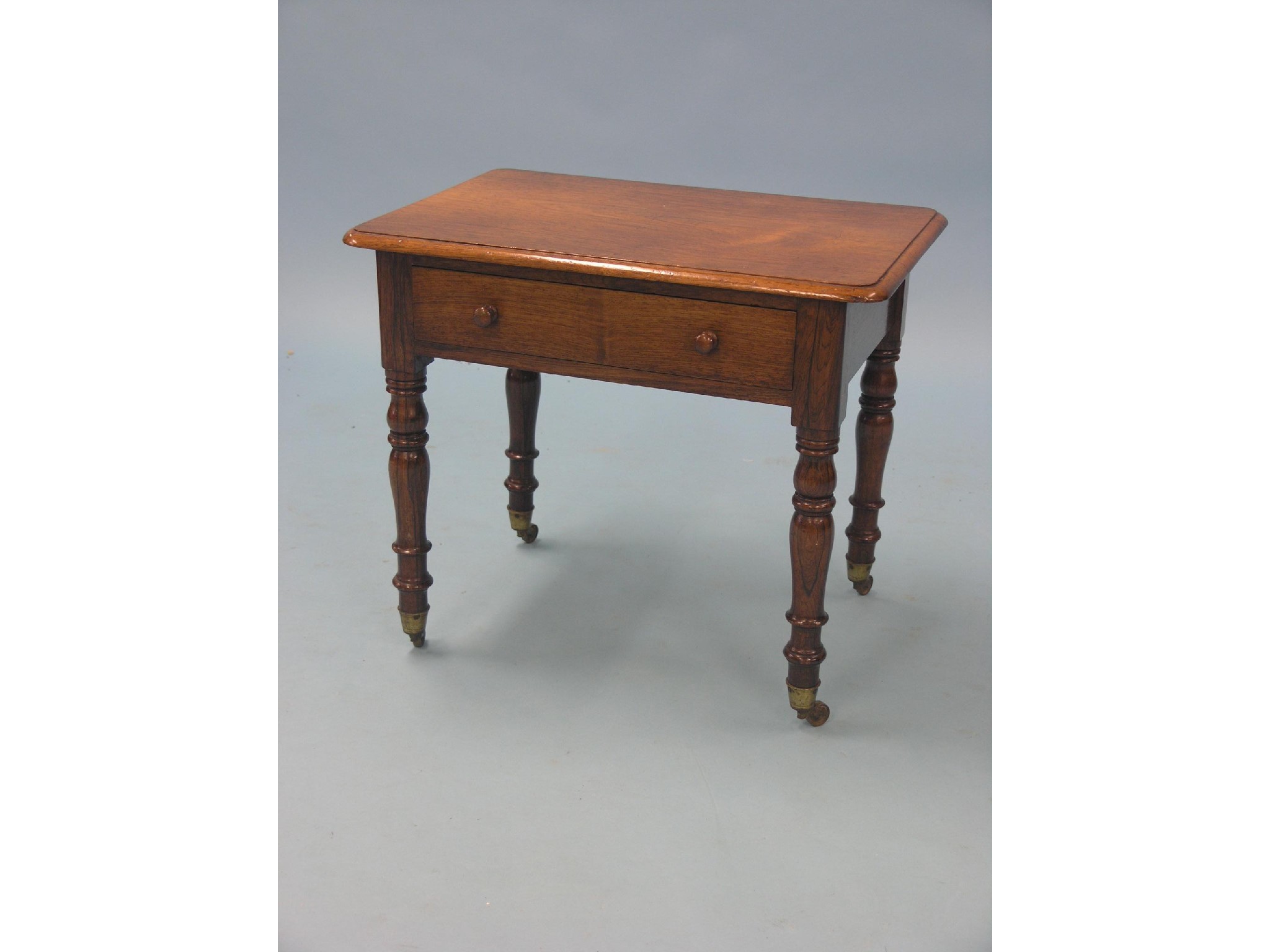 Appraisal: An unusual small Victorian rosewood side table rectangular-shape with single