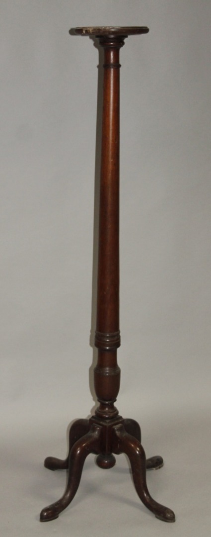 Appraisal: A late thC mahogany torchere the circular dished top on