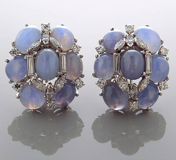 Appraisal: A pair of star sapphire and diamond cluster earrings estimated