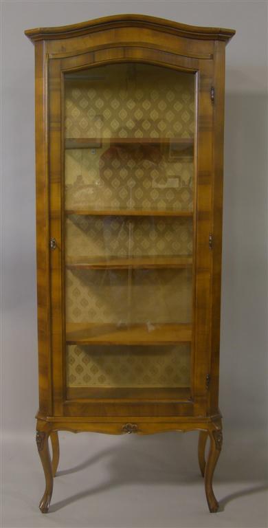 Appraisal: ITALIAN ROCOCO STYLE WALNUT GLASS DISPLAY CABINET The shaped cornice