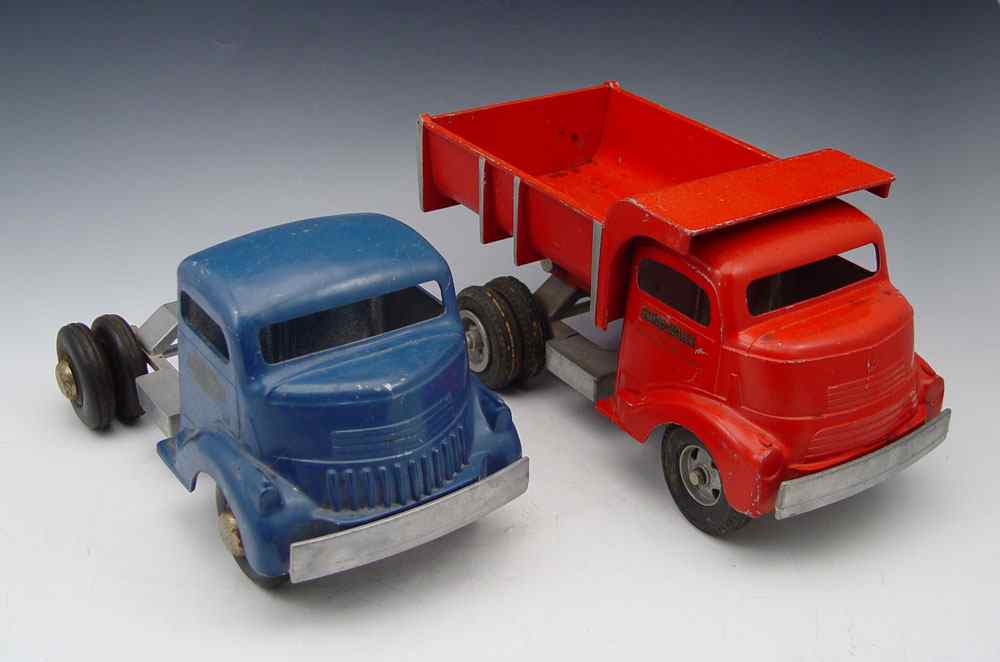 Appraisal: PIECE SMITH MILLER PRESSED STEEL TRUCKS To include Red Dump