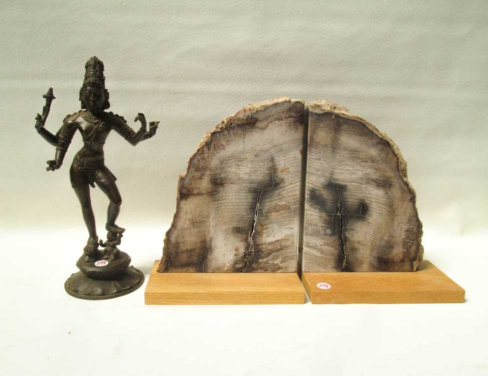 Appraisal: PAIR OF BOOKENDS AND A BRONZE FIGURAL SCULPTURE petrified wood